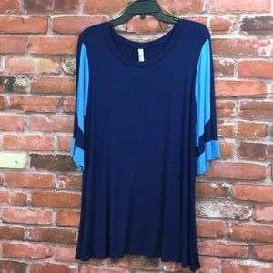 Navy blue with sky blue sleeves. Emerald tunic.